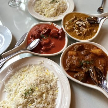 Saffron Grill - Butter Specialty (left), Vindaloo (bottom), and Shahi Korma (top) - Indian Near Me - Seattle, Washington Saffron Grill - Butter Specialty (left), Vindaloo (bottom), and Shahi Korma (top) - Indian Near Me - Seattle, Washington