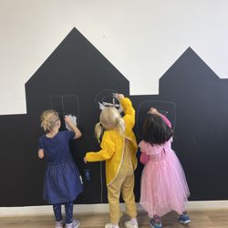 Art Backyard - We have a chalkboard wall, where kids can draw and express their emotions