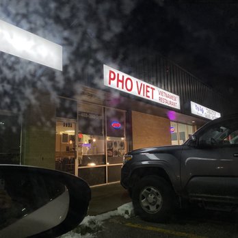 Pho Viet - a car parked in front of a pho viet restaurant - Vietnamese Near Me - Omaha, Nebraska