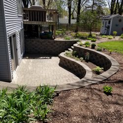 Landscape Impressions Design & Garden Center - When the lawn flows towards the house, This was a great solution.
