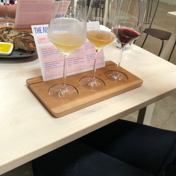 The Austin Winery - Tasting left to right Pet nat Aquapazza Violet Crown - Wine Tasting Room Near Me - Austin, Texas The Austin Winery - Tasting left to right Pet nat Aquapazza Violet Crown - Wine Tasting Room Near Me - Austin, Texas