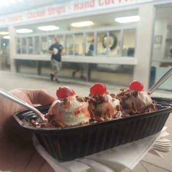 Sheridan's Frozen Custard - a hand holding a container of ice cream - Ice Cream & Frozen Yogurt Near Me - Topeka, Kansas Sheridan's Frozen Custard - a hand holding a container of ice cream - Ice Cream & Frozen Yogurt Near Me - Topeka, Kansas