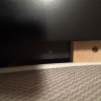 Dyno Moving - Pictures of the carelessly placed slats proving that something was unscrewed (take a look at the brown in the black wood) and not screwed in - Movers Near Me - New York, New York Dyno Moving - Pictures of the carelessly placed slats proving that something was unscrewed (take a look at the brown in the black wood) and not screwed in - Movers Near Me - New York, New York