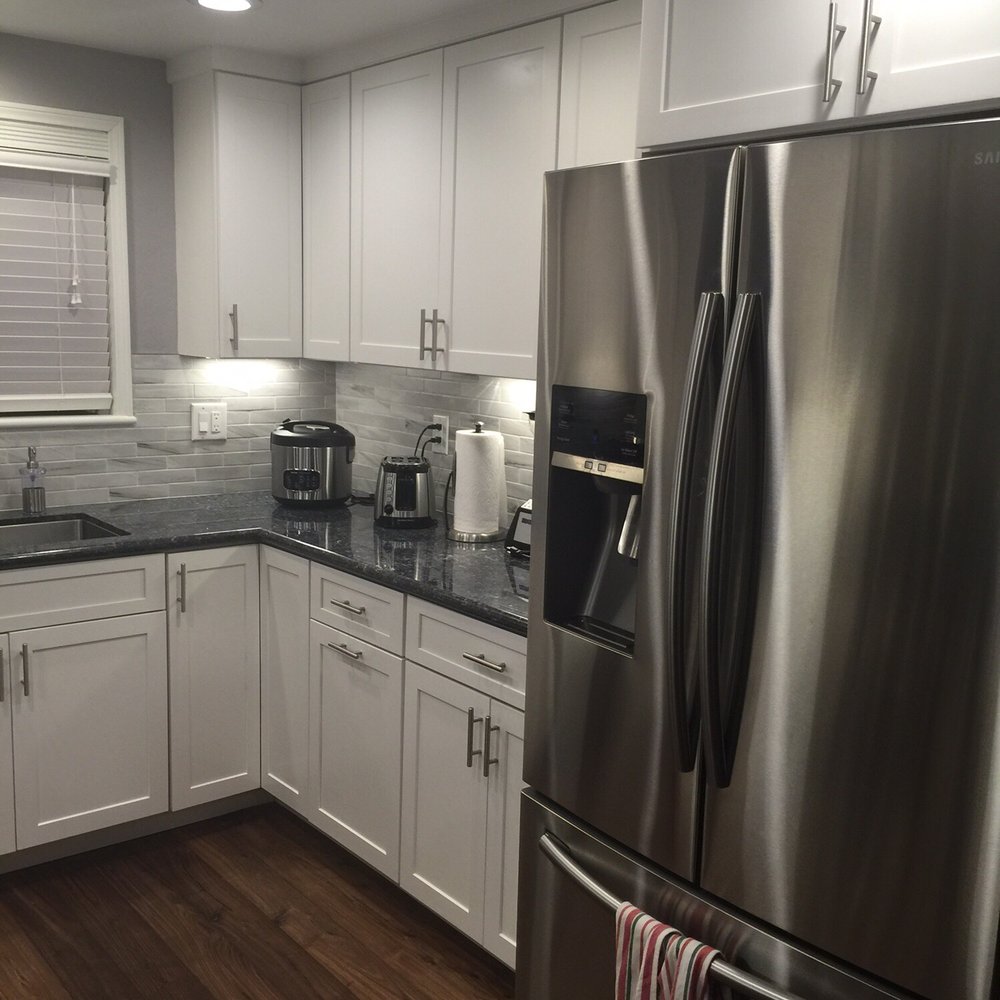 Bodhi Tree Construction - Much more efficient counter space with stove moved to the other side. - General Contractors Near Me