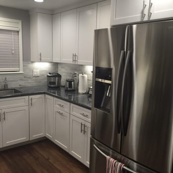 Bodhi Tree Construction - Much more efficient counter space with stove moved to the other side. - General Contractors Near Me