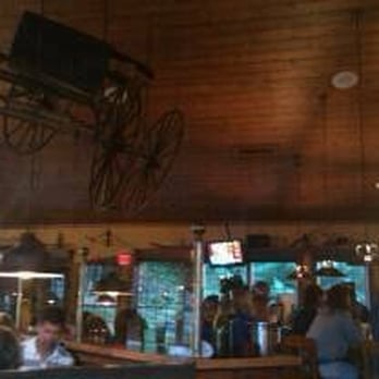 John Harvard's Brew House - old wagon dominates the scene. - American Near Me - Hancock, Massachusetts