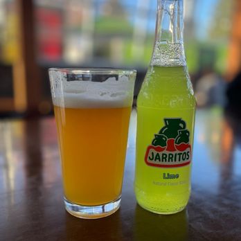 The Lot - a bottle and a glass on a table - Food Court Near Me - Bend, Oregon