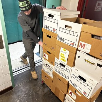 Junk Jumpers - Mason taking boxes up through the elevator. - Junk Removal & Hauling Near Me Junk Jumpers - Mason taking boxes up through the elevator. - Junk Removal & Hauling Near Me