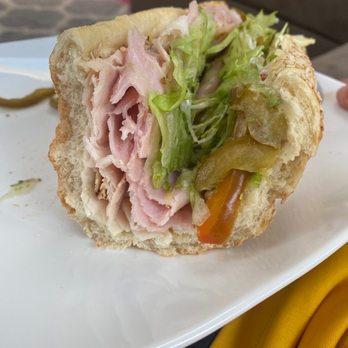 PrimoHoagies - a half eaten sandwich on a plate - Sandwiches Near Me - Aston, Pennsylvania PrimoHoagies - a half eaten sandwich on a plate - Sandwiches Near Me - Aston, Pennsylvania