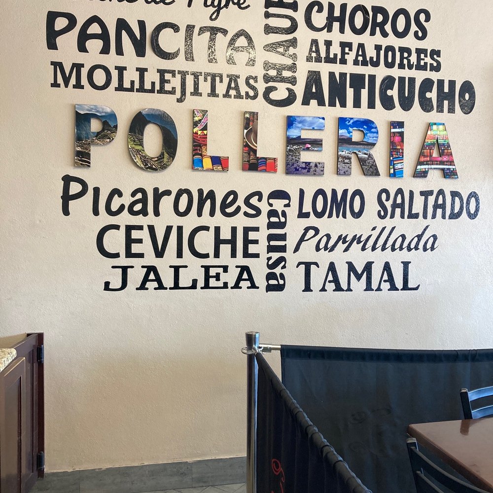 a restaurant with a large sign on the wall