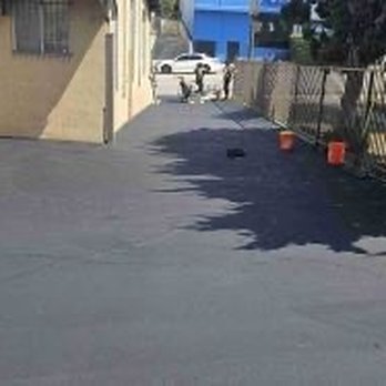 Jimenez Paving - Same parking lot with cracks filled and sealed. - General Contractors Near Me