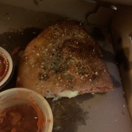 Half of the Italian calzone with sauce Half of the Italian calzone with sauce