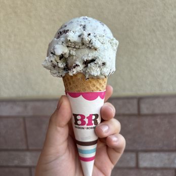 Baskin-Robbins - a hand holding a cone of ice cream - Ice Cream & Frozen Yogurt Near Me - Pasadena, California Baskin-Robbins - a hand holding a cone of ice cream - Ice Cream & Frozen Yogurt Near Me - Pasadena, California