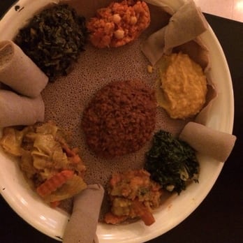 Lucy Ethiopian Cafe - The Veggie Combo for 2!! It's a lot of food and don't worry, they give you more bread (ingira) if you eat it all.. - Ethiopian Near Me - Boston, Massachusetts