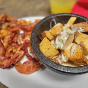 Cafe Olé - a bowl of potatoes, bacon, and gravy - Mexican Near Me - Memphis, Tennessee