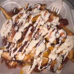 The Munchbox 615 - Grilled chicken loaded fries with cheese chicken beef bacon onions and tomatoes. I added ranch sour cream and hot sauce! Good!