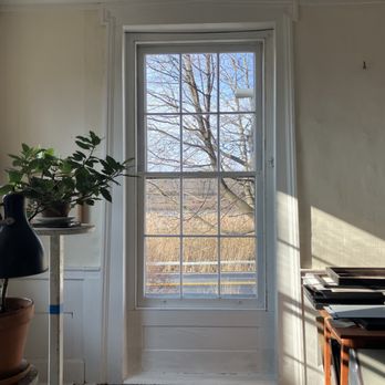 Silver Hammer Restoration - a window in a white room - General Contractors Near Me