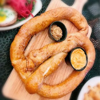 The Monk's Cellar - Large Pretzel $15. Served with spicy mustard & pub cheese. - Pubs Near Me - Roseville, California The Monk's Cellar - Large Pretzel $15. Served with spicy mustard & pub cheese. - Pubs Near Me - Roseville, California