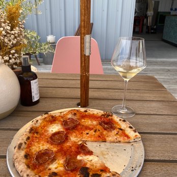 Lebber's Pizza - a half eaten pizza and a glass of wine - Pizza Near Me - Atascadero, California