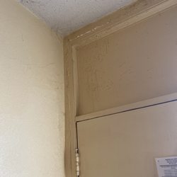 Diamond Inn & Suites - Spiderwebs in the corner of the room