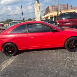 Side view of 2005 red Honda Civic