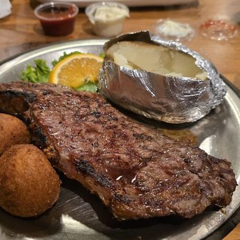 Henry's Restaurant - Ribeye with a baked potato - American Near Me - Kill Devil Hills, North Carolina