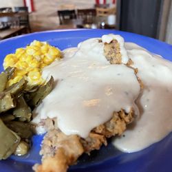 Babe's Chicken Dinner House - Chicken fried steak with green beans, corn, mashed potatoes and gravy