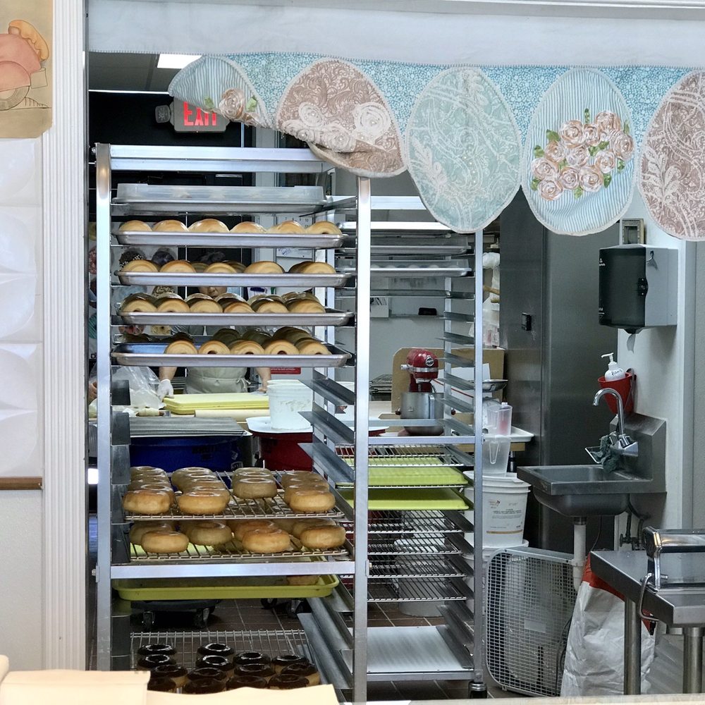 Kim's Donut - a baker's kitchen with lots of doughnuts - Donuts Near Me - Trophy Club, Texas