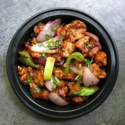 Chandni Chowk - Tibetan Zidron chicken take out. This is medium spicy with mild hint of sichuan peppers.Cilantro garnish makes it extra aromatic.