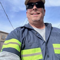 E R A Emergency Roadside Assistance - Actual photo as he was handing me his cards. Very smiley guy!