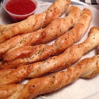 Cosmos Pizza - Breadsticks with marinara sauce. - Pizza Near Me - Corolla, North Carolina