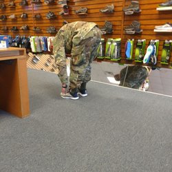Below The Knee - My husband trying on some new Asics.