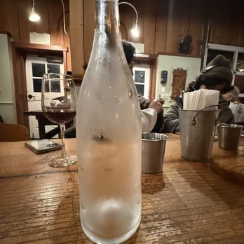 Full Of Life Flatbread - A cool glass bottle  of water. - New American Near Me - Los Alamos, California