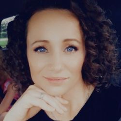 She has beautiful natural curls just need some layers to add bounce