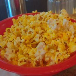 a bowl of popcorn and a glass of beer a bowl of popcorn and a glass of beer