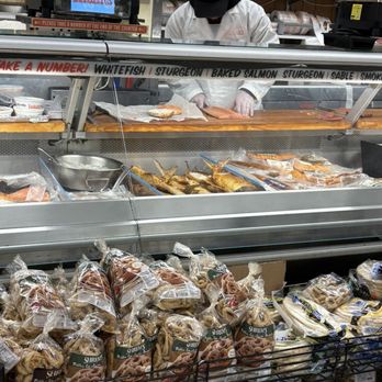 Zabar's - Counter man carefully slicing the nova for the bagel sandwich.  Love it. - Bakeries Near Me - New York, New York