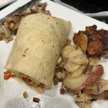 Keke's Breakfast Cafe - Breakfast Wrap with Eggs, red peppers, onions, Spinach and provolone cheese with crispy home fried potatoes - Breakfast & Brunch Near Me - Fort Myers, Florida Keke's Breakfast Cafe - Breakfast Wrap with Eggs, red peppers, onions, Spinach and provolone cheese with crispy home fried potatoes - Breakfast & Brunch Near Me - Fort Myers, Florida