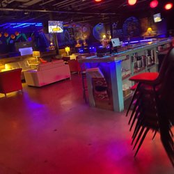 LUXX Sport Hookah Lounge - Seating area in front of the bar (Dj is posted behind the tv to the left