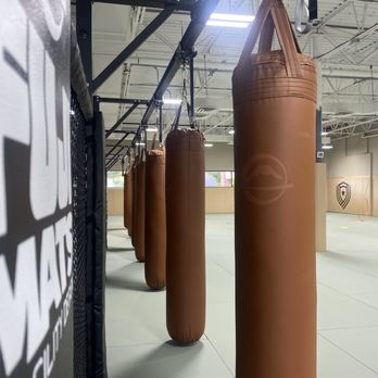 VIA Jiu Jitsu Academy - Bag row runs the length of the cage. Striking, conditioning, or working off a bad day - Brazilian Jiu-jitsu Near Me - Milford, Connecticut VIA Jiu Jitsu Academy - Bag row runs the length of the cage. Striking, conditioning, or working off a bad day - Brazilian Jiu-jitsu Near Me - Milford, Connecticut