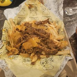 Partially eaten chili cheese fries Partially eaten chili cheese fries
