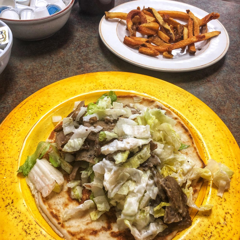 Gyro sandwhich. Mostly lettuce. French fries ordered overdone. That's how they came.
