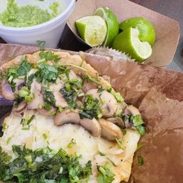 The inside of my mushroom quesa-taco. Fresh mushrooms, tons of cheese, handmade tortillas, fresh salsa.