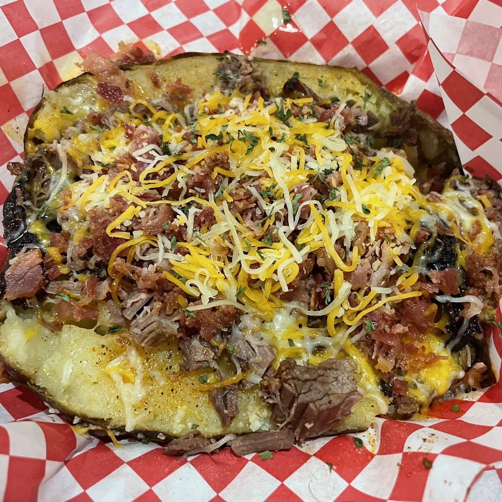 T's BBQ - Stuffed Large Baked Potato; the brisket and bacon really hit the mark! - Barbeque Near Me - Harrison, Arkansas T's BBQ - Stuffed Large Baked Potato; the brisket and bacon really hit the mark! - Barbeque Near Me - Harrison, Arkansas