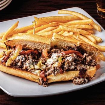 Inga's Alpine Tavern - What they claim to make, but their cheesesteak looks nothing like this and is 1/2 the portion. - Cocktail Bars Near Me - Glendale, Colorado