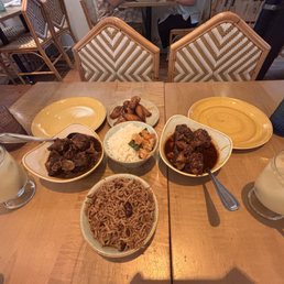 Oxtail stew, curry goat, rice and peas, nonalcoholic ginger beer. Oxtail stew, curry goat, rice and peas, nonalcoholic ginger beer.