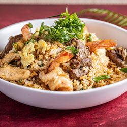 Inca Paisa restaurant Astoria - Peruvian-style Arroz Chaufa, a flavorful stir-fried rice dish prepared with traditional ingredients and served at Inca Paisa ...