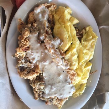 Tapester's Grill - Chicken fried steak with scrambled eggs and hash browns (underneath). - American Near Me - Houston, Texas Tapester's Grill - Chicken fried steak with scrambled eggs and hash browns (underneath). - American Near Me - Houston, Texas