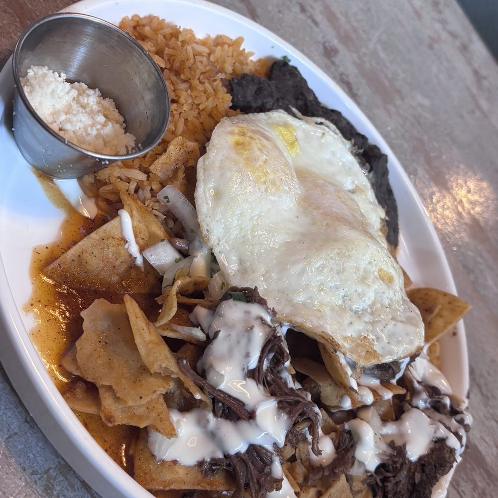 Toast Kitchen & Bar - This is short ribs chilaquiles - Breakfast & Brunch Near Me - Brea, California Toast Kitchen & Bar - This is short ribs chilaquiles - Breakfast & Brunch Near Me - Brea, California