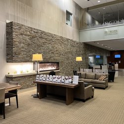 Fred Hutchinson Cancer Center - Proton Therapy - The cozy lobby with a warm fire, there's even more seating and a snack bar to the right.