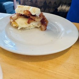 Egg sandwich with bacon and buttermilk biscuit
